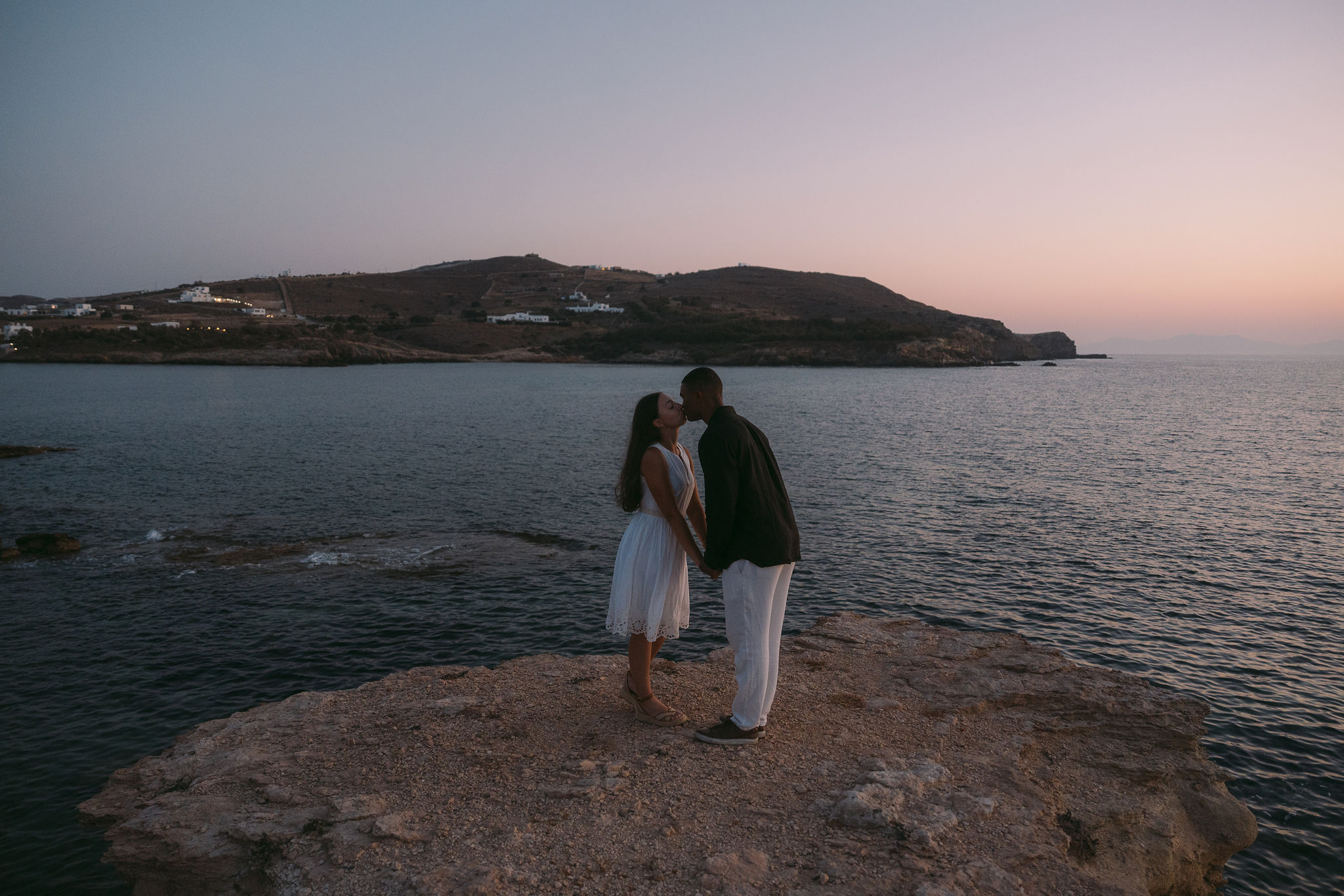 Newly engaged couple walking through Antiparos Town