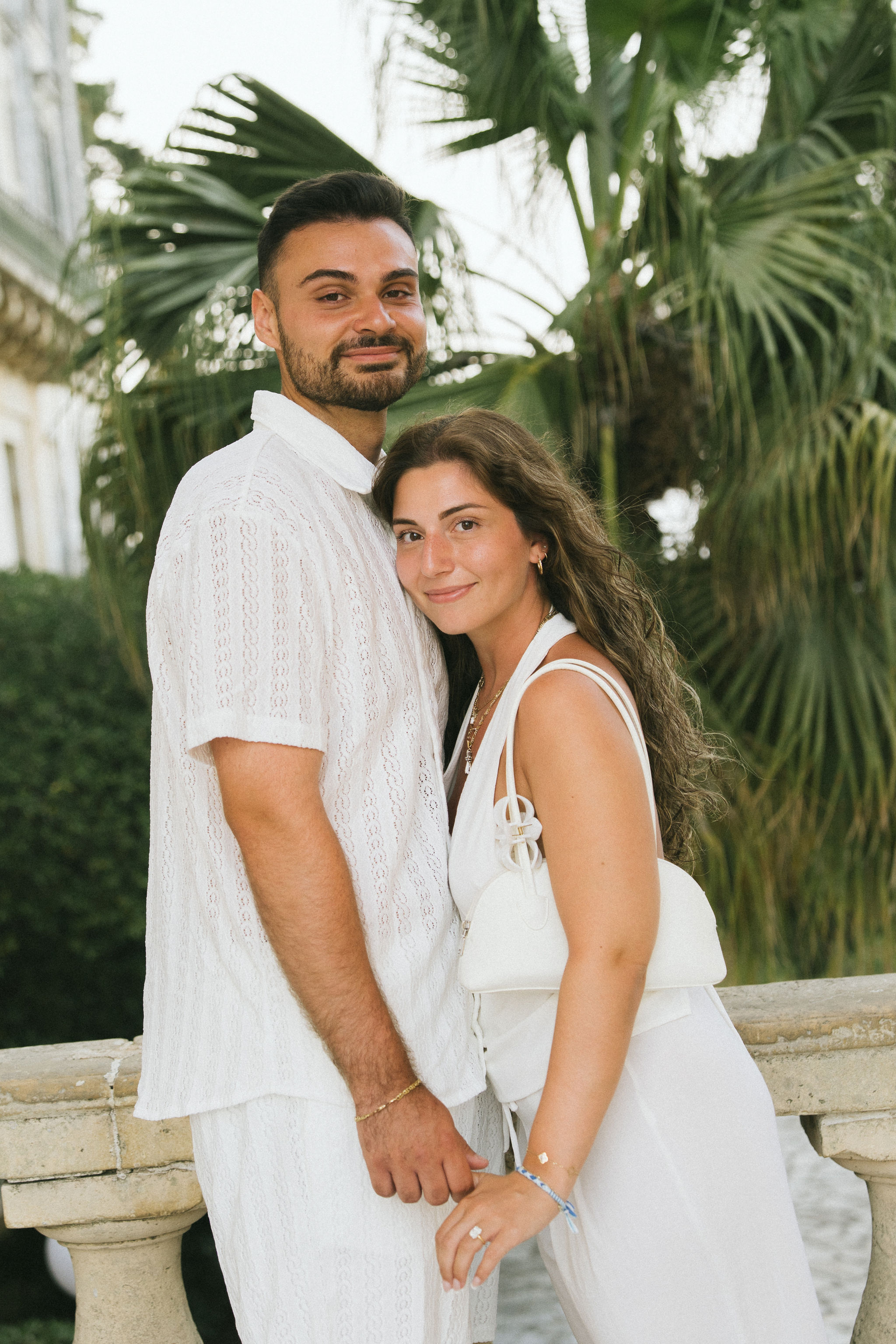 Newly engaged couple celebrating their surprise proposal in Corfu, Greece