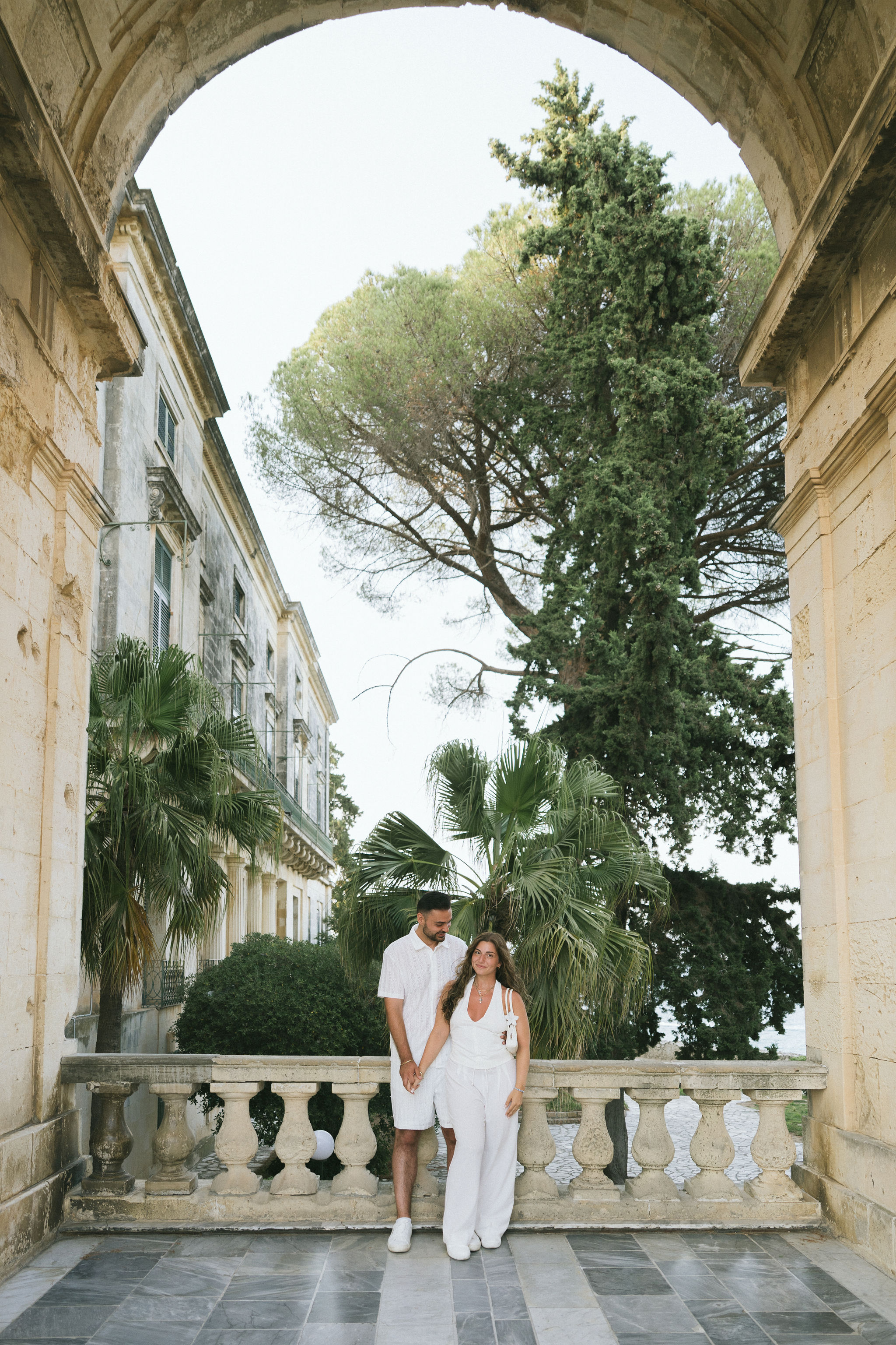 Newly engaged couple celebrating their surprise proposal in Corfu, Greece