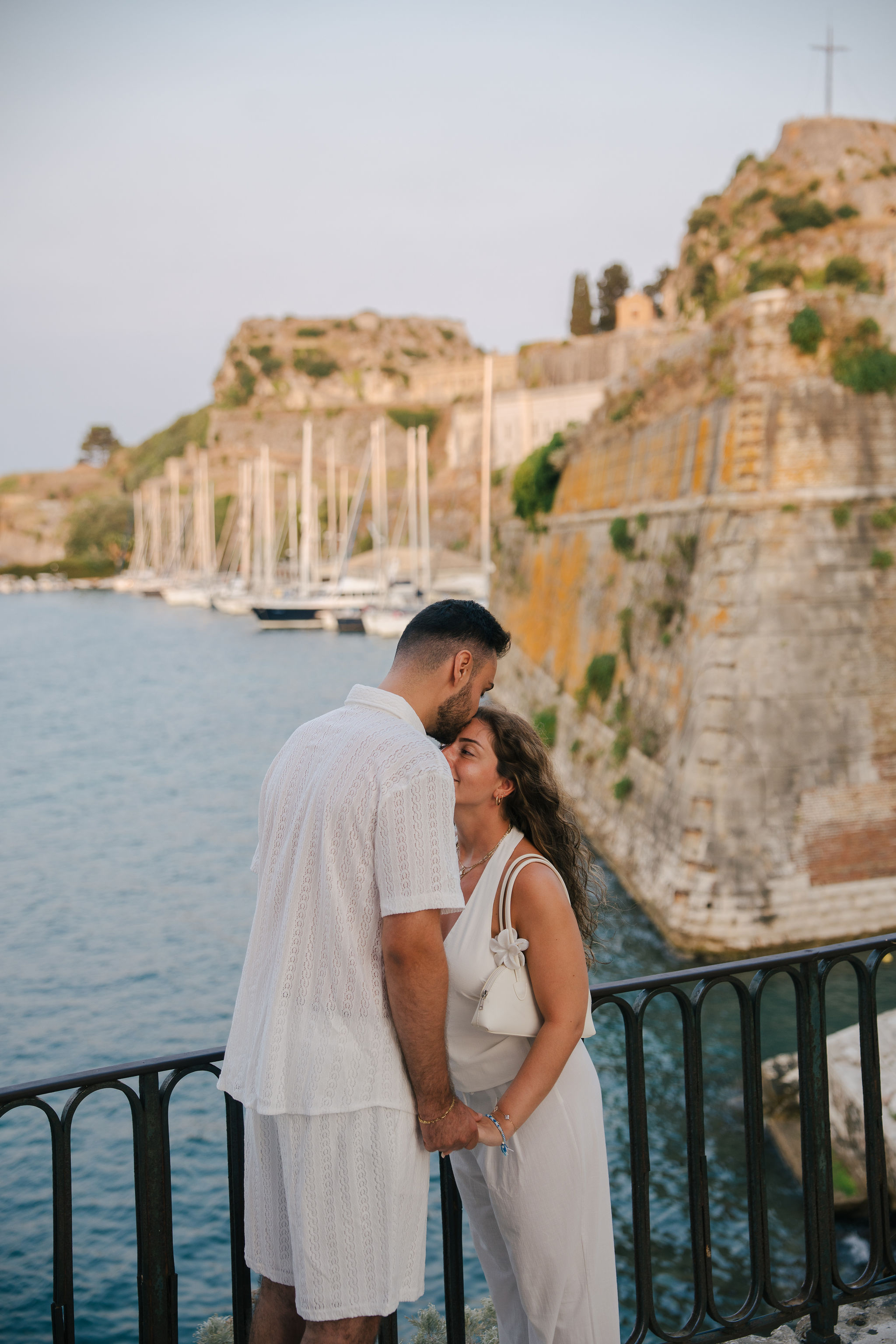 Newly engaged couple celebrating their surprise proposal in Corfu, Greece
